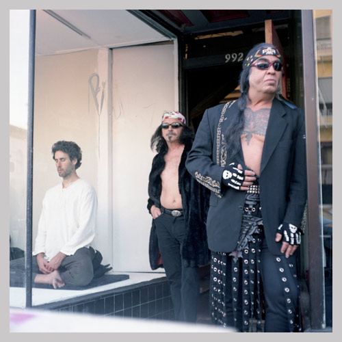 three men in store front